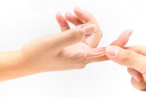 A Hand With An Overlay Of The Hand Bones Being Touched By A Thumb. 