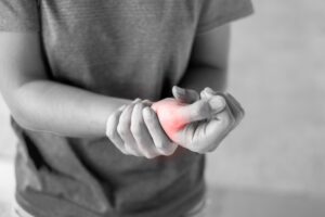 A Woman Holds Her Broken Wrist. 