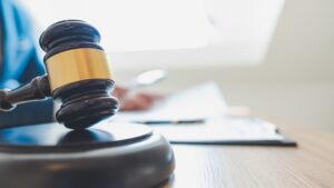 A Gavel On A Wooden Table. 