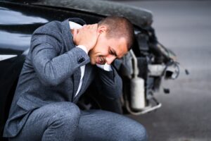 A Man Holds His Neck Following A Car Crash. 