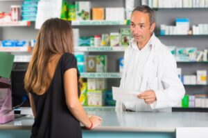 A pharmacists dispensing medications after a doctor prescribed the medication