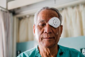 A man with an eye patch after negligent eye surgery.