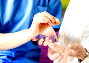 a nurse administering wrongly prescribed antidepressants to an elderly patient