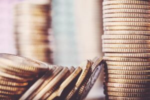 A close up of a stack of coins representing a payout for a claim for a care worker data breach.