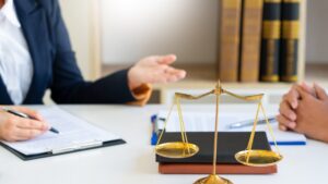 A solicitor explaining the claims process to a client who asked "A colleague shared my personal data, what can I do?".