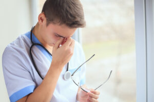 A healthcare worker shows signs of psychological injuries.