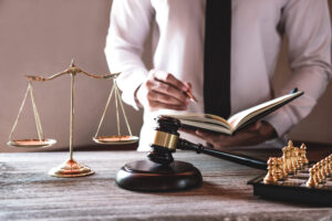 A solicitor works on a claim for NHS injury at work compensation.