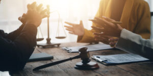 A solicitor and client are discussing their accident at work claim