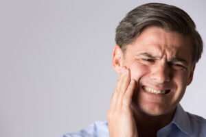 A man suffers with toothache