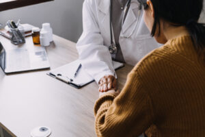 A doctor explains the harm caused by delayed treatment to a patient.