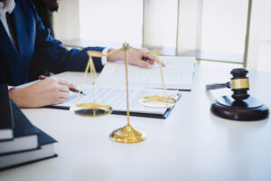 A solicitor works on a delayed treatment claim.