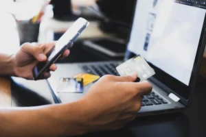 A person sits at a computer shopping online.